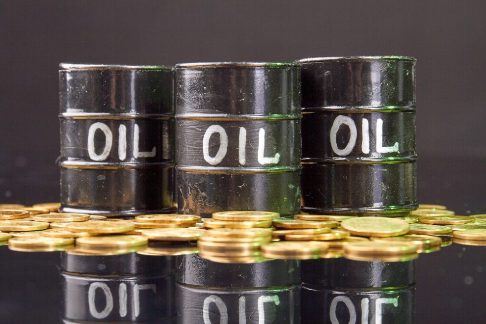 barrels-with-oil-golden-coins-reflective-desk