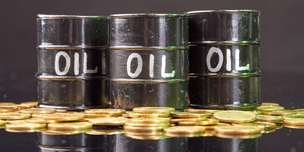barrels-with-oil-golden-coins-reflective-desk-1