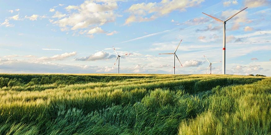 beautiful-shot-wind-turbines-cloudy-sky-eiffel-region-germany